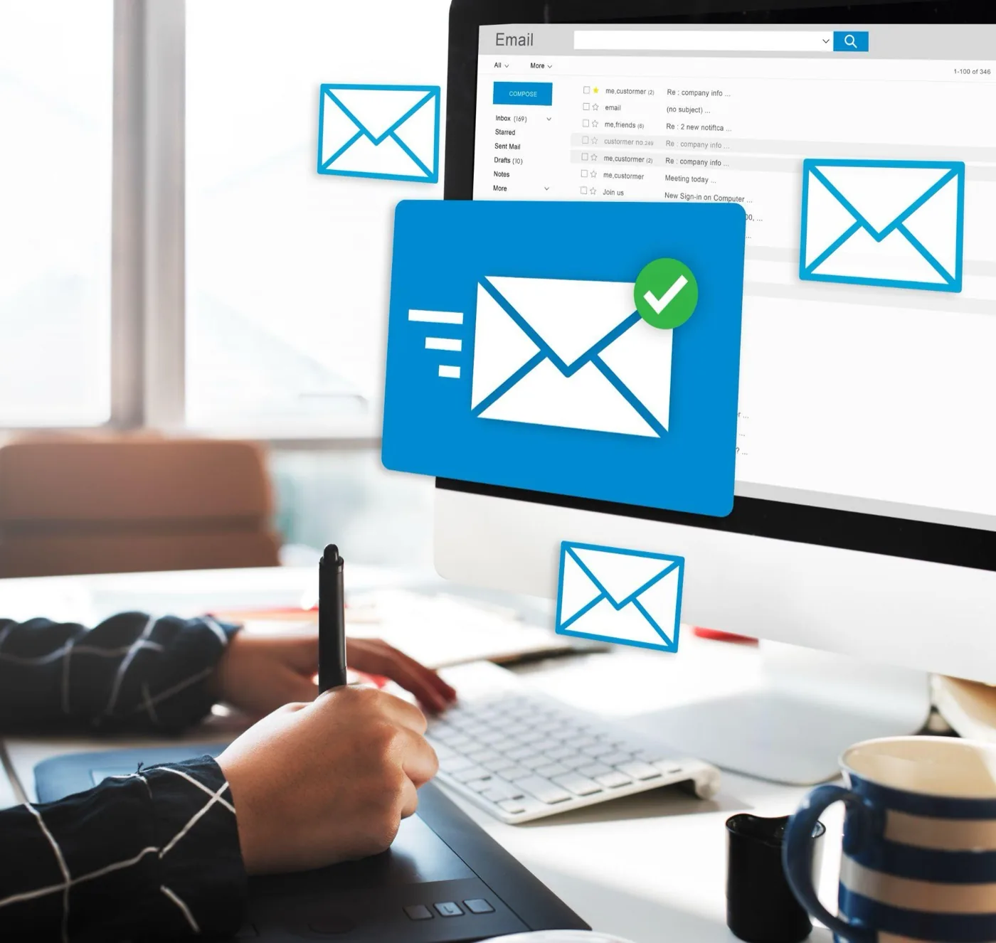 Envelope icons floating around a monitor showing an email inbox